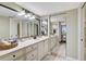 Bathroom featuring double vanity with large mirrors and ample storage at 6372 Palma Del Mar S Blvd # 503, St Petersburg, FL 33715