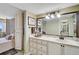 Bathroom featuring double vanity, a large mirror and ensuite access to the main bedroom at 6372 Palma Del Mar S Blvd # 503, St Petersburg, FL 33715
