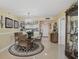 Cozy dining room with chandelier, rug, and views into the kitchen at 6372 Palma Del Mar S Blvd # 503, St Petersburg, FL 33715