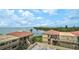 Beautiful exterior view of condos with tile roofs overlooking the water at 6372 Palma Del Mar S Blvd # 503, St Petersburg, FL 33715