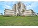 Exterior view of a high-rise condo building with well-maintained landscaping at 6372 Palma Del Mar S Blvd # 503, St Petersburg, FL 33715