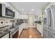 Updated kitchen with stainless steel appliances and granite countertops at 6372 Palma Del Mar S Blvd # 503, St Petersburg, FL 33715