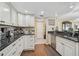 Updated kitchen features granite countertops, stainless appliances, and hardwood floor at 6372 Palma Del Mar S Blvd # 503, St Petersburg, FL 33715