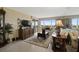 Living room with TV, comfortable seating, and an oriental rug at 6372 Palma Del Mar S Blvd # 503, St Petersburg, FL 33715