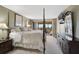 A primary bedroom featuring a four poster bed with views of the waterway and outside balcony at 6372 Palma Del Mar S Blvd # 503, St Petersburg, FL 33715