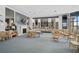 Bright recreation room features cozy seating, a fireplace, and bookshelves at 6372 Palma Del Mar S Blvd # 503, St Petersburg, FL 33715