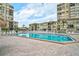 Expansive swimming pool with lounge chairs and condos in the background at 6372 Palma Del Mar S Blvd # 503, St Petersburg, FL 33715