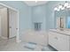 Calming bathroom featuring a tub, sink and light blue wall at 6643 Butlers Crest Dr, Bradenton, FL 34203