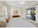 Serene bedroom with direct access to the pool area through sliding glass doors, flooding the space with natural light at 6643 Butlers Crest Dr, Bradenton, FL 34203