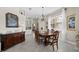 Formal dining room with a wooden table, ornate chairs, and a decorative buffet at 6643 Butlers Crest Dr, Bradenton, FL 34203