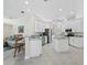 Spacious kitchen featuring stainless steel appliances, white cabinets, granite counters, and an island at 6643 Butlers Crest Dr, Bradenton, FL 34203