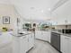 Open concept kitchen featuring granite countertops, an island with sink, and stainless steel appliances at 6643 Butlers Crest Dr, Bradenton, FL 34203