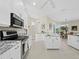 Modern kitchen featuring white cabinets, stainless steel appliances, and granite countertops at 6643 Butlers Crest Dr, Bradenton, FL 34203