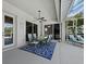 Covered patio with dining area and additional lounge seating at 6643 Butlers Crest Dr, Bradenton, FL 34203