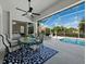 Spacious screened-in patio with an outdoor dining area, pool view, and comfortable seating at 6643 Butlers Crest Dr, Bradenton, FL 34203