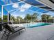 Relaxing poolside with covered, screened patio and lounge chairs at 6643 Butlers Crest Dr, Bradenton, FL 34203