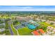 Picturesque aerial of community amenities including a golf course, tennis courts and pools at 7804 Broadmoor Pines Blvd, Sarasota, FL 34243