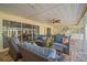 Comfortable covered patio with seating and a ceiling fan, perfect for outdoor relaxation at 7804 Broadmoor Pines Blvd, Sarasota, FL 34243