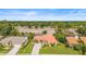 Beautiful single-Gathering home boasting a lovely landscape, screen enclosed pool, and a spacious driveway at 7804 Broadmoor Pines Blvd, Sarasota, FL 34243