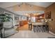 Open kitchen with granite counters, tile flooring, and a breakfast bar at 7804 Broadmoor Pines Blvd, Sarasota, FL 34243