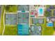 An overhead view featuring well-maintained tennis courts and a community pool at 7804 Broadmoor Pines Blvd, Sarasota, FL 34243