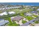 Expansive aerial view captures a serene neighborhood with lush greenery and a beautiful home with a private pool at 7913 19Th Avenue W Dr, Bradenton, FL 34209