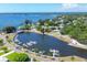 Panoramic aerial view highlighting the bay, marina and boats in a gorgeous waterfront community at 7913 19Th Avenue W Dr, Bradenton, FL 34209