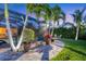 Paver pathway, tropical landscaping, and screened pool, perfect for outdoor entertaining at 7913 19Th Avenue W Dr, Bradenton, FL 34209