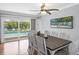 Bright dining area with sliding glass doors showcasing the pool and backyard oasis at 7913 19Th Avenue W Dr, Bradenton, FL 34209