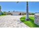 Beautiful single story home with a brick driveway, manicured landscaping, and a pristine two car garage at 7913 19Th Avenue W Dr, Bradenton, FL 34209