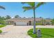 Stunning single story home with a brick driveway, manicured landscaping, and a pristine two car garage at 7913 19Th Avenue W Dr, Bradenton, FL 34209