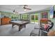 Game room featuring a billiard table and many windows at 7913 19Th Avenue W Dr, Bradenton, FL 34209