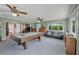 Large game room featuring a billiard table, ceiling fans, and lots of natural light at 7913 19Th Avenue W Dr, Bradenton, FL 34209