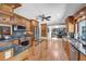 Open kitchen showcasing stainless steel appliances, custom cabinetry, and granite countertops at 7913 19Th Avenue W Dr, Bradenton, FL 34209