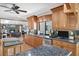 Stylish kitchen with stainless steel appliances, custom cabinetry, and granite countertops at 7913 19Th Avenue W Dr, Bradenton, FL 34209