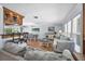 Bright and airy living room and dining area with hardwood floors, a wet bar, and large windows, perfect for entertaining at 7913 19Th Avenue W Dr, Bradenton, FL 34209