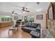 Inviting living room with hardwood floors, stone fireplace and sliding glass doors to the outdoor area at 7913 19Th Avenue W Dr, Bradenton, FL 34209