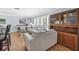 Spacious living room boasts hardwood floors, soft blue walls, and built-in cabinetry for storing your treasures at 7913 19Th Avenue W Dr, Bradenton, FL 34209