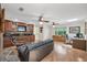 Spacious living room offering a built-in bar area with wood cabinets and an adjacent office at 7913 19Th Avenue W Dr, Bradenton, FL 34209