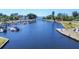 Wide angle aerial view of the marina featuring boats docked along a tranquil waterway near residential homes at 7913 19Th Avenue W Dr, Bradenton, FL 34209