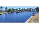 Scenic view of the marina and tranquil waterway featuring boats docked near waterfront homes and lush landscaping at 7913 19Th Avenue W Dr, Bradenton, FL 34209