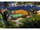 Aerial view of screened pool area with outdoor seating and tropical surroundings at 7913 19Th Avenue W Dr, Bradenton, FL 34209