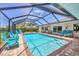 Sparkling in-ground pool with a screened-in enclosure and relaxing lounge chairs at 7913 19Th Avenue W Dr, Bradenton, FL 34209