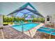 Beautiful in-ground pool with screened-in enclosure at 7913 19Th Avenue W Dr, Bradenton, FL 34209