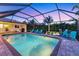 Relaxing outdoor pool surrounded by lush tropical landscaping and comfortable seating at 7913 19Th Avenue W Dr, Bradenton, FL 34209