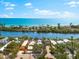 Coastal home features waterfront access, lush landscaping, and a private pool, with ocean views at 8234 Midnight Pass Rd, Sarasota, FL 34242