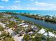 Waterfront home with mature landscaping, private pool, and scenic views of the channel and ocean at 8234 Midnight Pass Rd, Sarasota, FL 34242