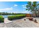 Serene waterfront backyard featuring a fire pit and a path leading to a private dock at 8234 Midnight Pass Rd, Sarasota, FL 34242