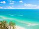 Bright blue water and white sand shoreline at 8234 Midnight Pass Rd, Sarasota, FL 34242