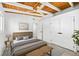 Cozy bedroom featuring a wood ceiling, white walls, and plenty of closet space at 8234 Midnight Pass Rd, Sarasota, FL 34242